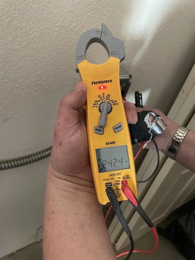 Voltage testing with clamp meter during Generator Installation in Northampton